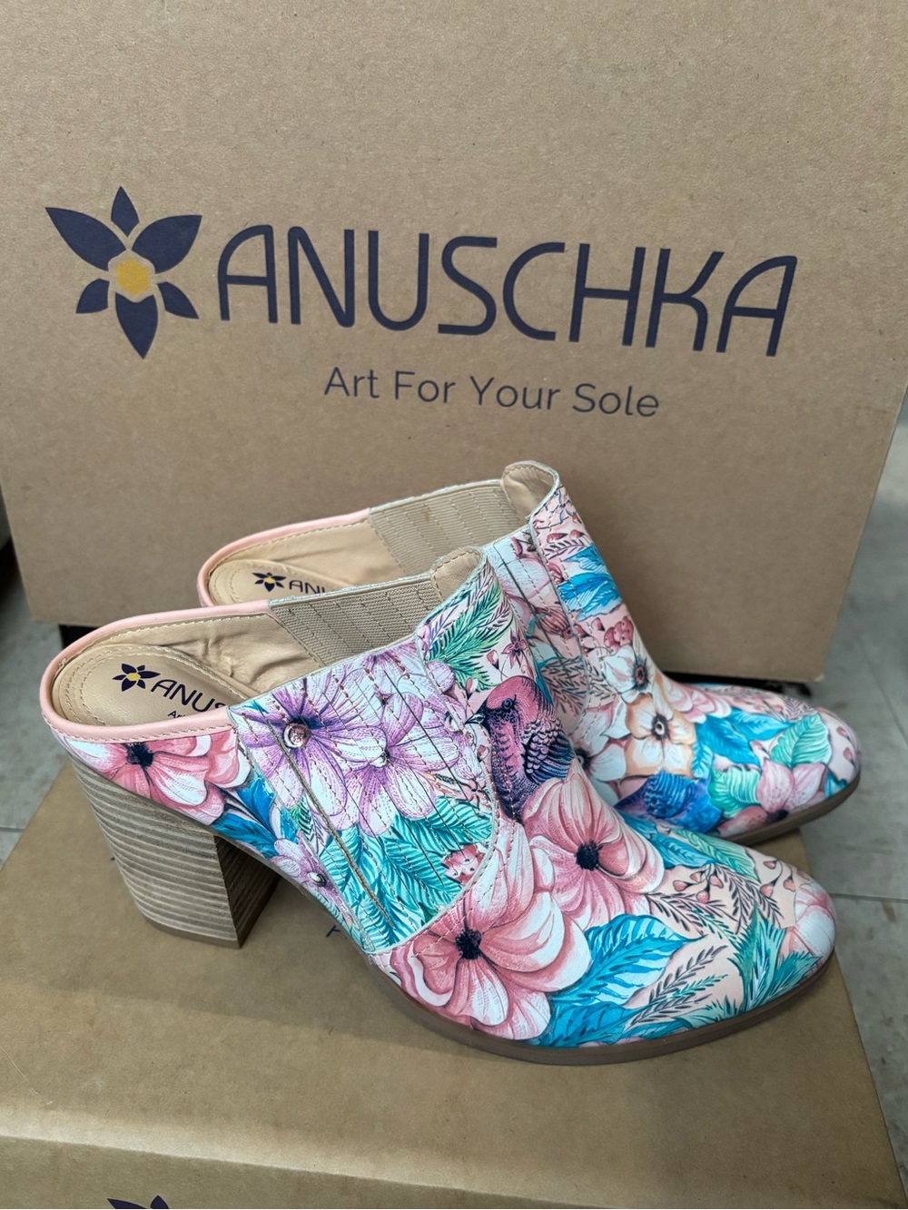 New ANUSCHKA leather Elegant clogs with a vibrant floral pattern.